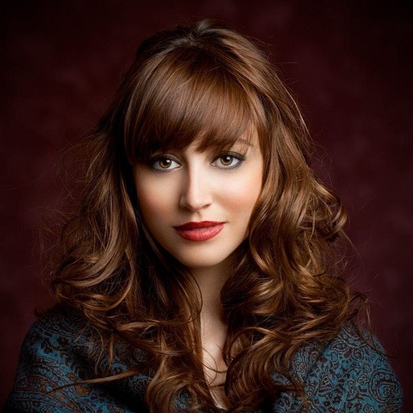 side swept bangs round face curly hair